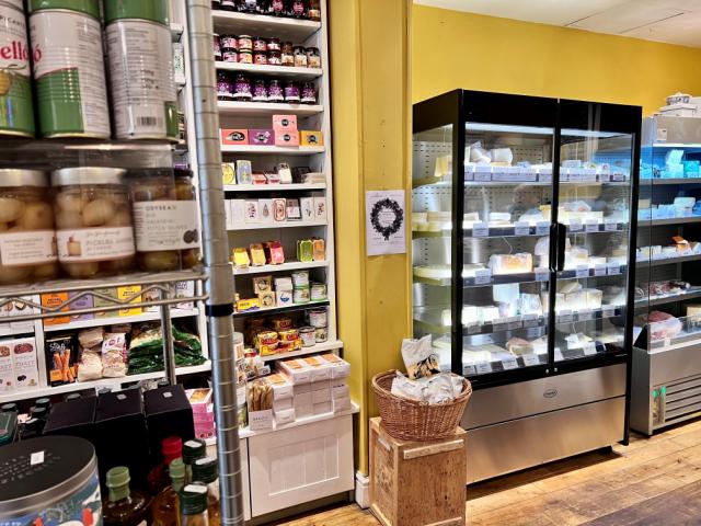 Multideck cabinets loaded with products in a beautiful cafe setting